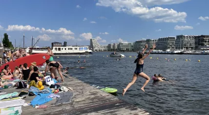 People enjoying the sun and water in Amsterdam-Oost. 11 June 2023