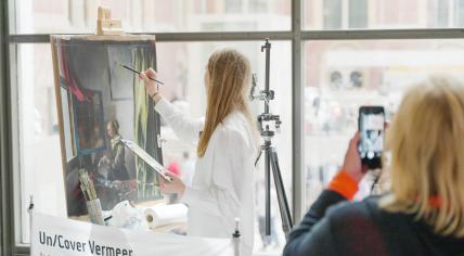 "Un/cover Vermeer" performance by a German-Russian artist Jessica Kuhn along the Rijksmuseum Passage, Amsterdam, May 2023.