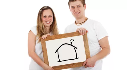 A young couple buying a home and taking out a mortgage