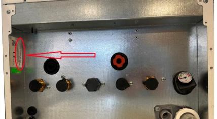 Arrow indicating the position of the serial number under a Ferroli BlueHelix boiler