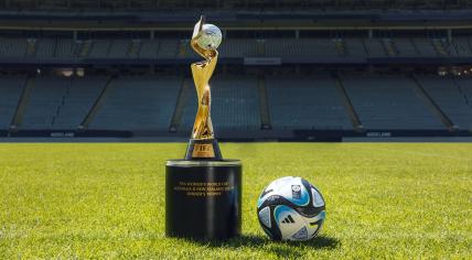 The 2023 FIFA Women's World Cup trophy alongside the official match ball from Adidas. 2023