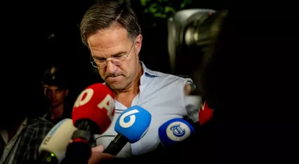 Prime Minister Mark Rutte speaks to reporters before 2 a.m. after the coalition's crisis meeting over asylum policy. 7 July 2023