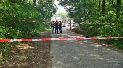 Police officers at the scene of a fatal shooting at a mobile home park on Heezerweg in Eindhoven. 10 July 2023
