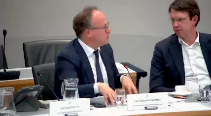 Wouter Koolmees from the NS and ProRail CEO John Voppen defend their organizations' response to June train disruptions during a Tweede Kamer committee meeting. 4 July 2023