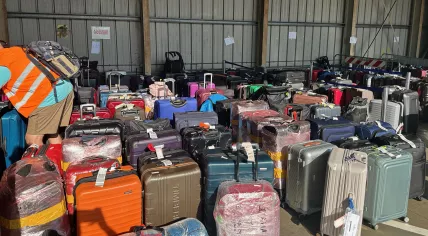 Baggage stuck since June 28 at Schiphol Airport lined up at the airport in Florence, Italy on July 9, 2023