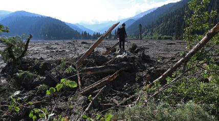 A rescuer takes part in a search and rescue operation at the site of a landslide in the Racha Region, Georgia August 4, 2023.