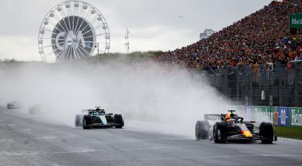 Max Verstappen in the Red Bull car, and Fernando Alonso from Aston Martin as the race gets back under way after a red flag during the Dutch Grand Prix. 27 August 2023