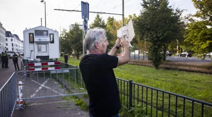 Pegida leader Edwin Wagensveld tears up a copy of the Quran during a single-person protest at the Turkish embassy in The Hague. 18 August 2023