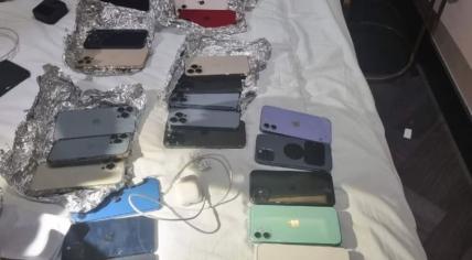 Stolen phones seized from a suspected pickpocket in an Amsterdam hotel room during Queer & Pride Amsterdam, August 2023