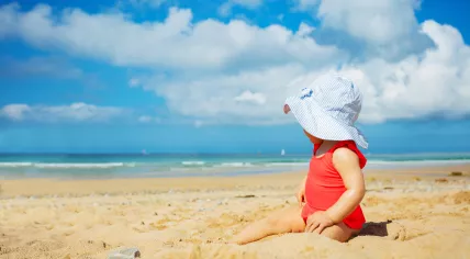 A baby on a sunny beach