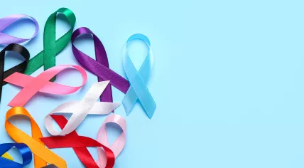 Colorful awareness ribbons on blue background