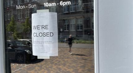 Sign in the window of the VanMoof flagship store in Amsterdam, 14 August 2023