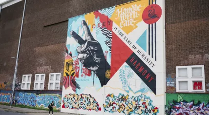 Shepard Fairey - Raise the Level - Mural at STRAAT Museum