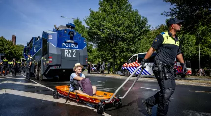 The police remove climate activists from blocked A12 in The Hague. 