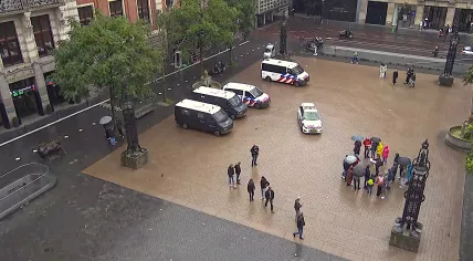 Several police vehicles stage on the Beursplein in Amsterdam ahead of the Ajax-Marseille Europa League match. 21 September 2023