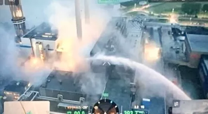 Firefighters extinguish a major fire at a waste processing plant in Rotterdam.