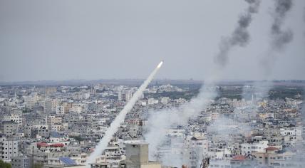 Rockets are launched by Palestinian militants from the Gaza Strip towards Israel, in Gaza, Saturday, Oct. 7, 2023.