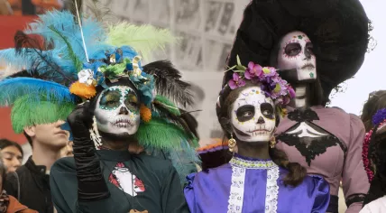 People dressed as Catrinas during the Day of the Dead boat parade in Amsterdam. October 2022.