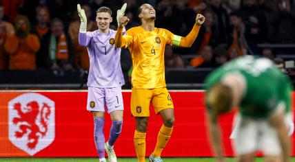 Holland goalkeeper Bart Verbruggen, Virgil van Dijk of Holland celebrate the victory during the European Championship match in group B between the Netherlands and Ireland in the Johan Cruijff ArenA on 18 november 2023 in Amsterdam, Netherlands. 