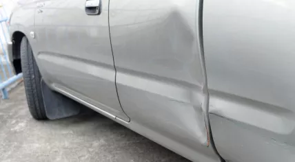 Car with a dent in the door