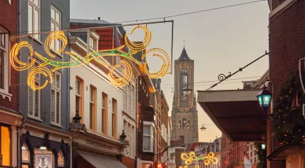 Shopping street in Arnhem with Christmas decoration. December 2022.