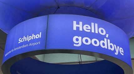 A sign at Schiphol Airport saying "hello, goodbye," 1 November 2023