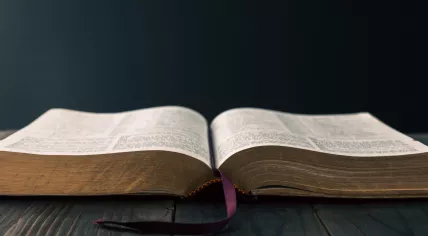 Christian bible on a wooden table