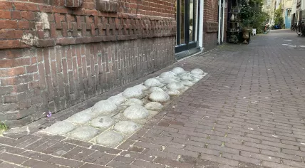 Bumpy bricks trial on the Bethaniënstraat in the Red Light District in Amsterdam to stop drug dealers in Amsterdam. 6 December 2024.