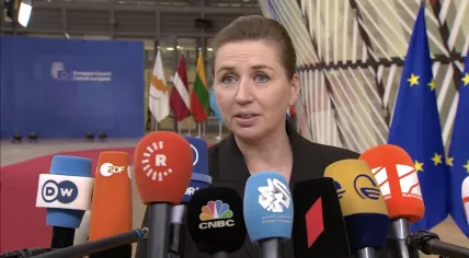  Danish Prime Minister Mette Frederiksen speaks with the media as she arrives for an EU summit at the European Council building in Brussels. 14 December 2023.