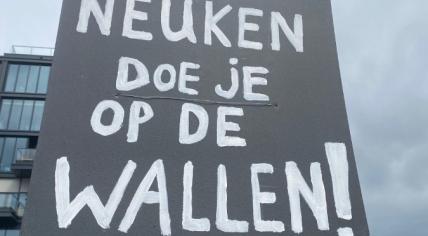 Sign at the NDSM-Werf protesting against the Erotic Center, stating “Do your fucking in De Wallen” in Dutch. March 2023.