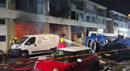 Firefighters attempt to tackle the flames after an explosion in a building on Schammenkamp in Rotterdam-Zuid. 29 January 2024