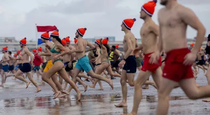Over 10,000 people ran into the North Sea from Scheveningen for the annual New Year's Dive. 1 January 2024