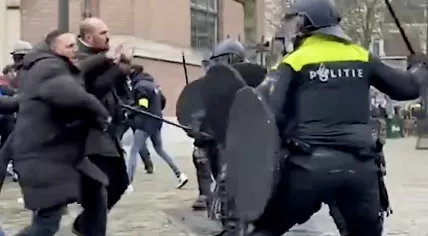 Police clash with people demonstrating against a Pegida Quran burning stunt in Arnhem. 13 January 2024