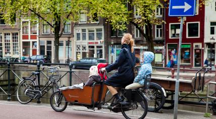 Mother with three children on the bicycle in Amsterdam