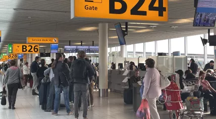 Passengers boarding a KLM flight at Schiphol Airport. 1 November 2023