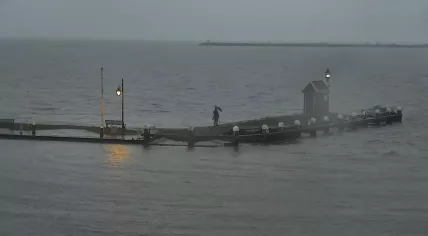 One man looks out over the Markermeer from the Volendam Harbor shortly before Storm Henk's arrival. 2 January 2023