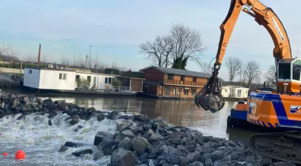 Workers complete an emergency dam at Bosscherveld in Maastricht. 8 January 2024