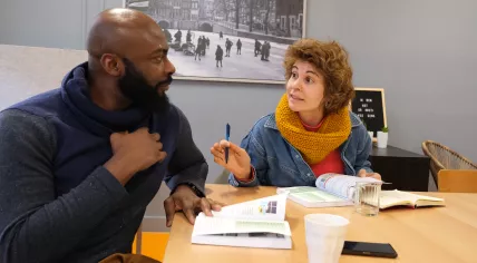 Students speaking in Dutch with each other during a language course at NedLes in Amsterdam-Oost. 28 January 2024