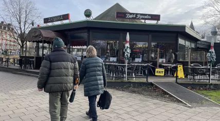 People walking by De Carrousel pancake restaurant in Amsterdam Centrum. 7 February 2024