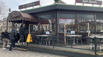 Customers walking into De Carrousel pancake restaurant in Amsterdam Centrum. 7 February 2024