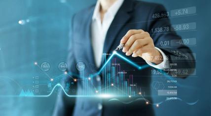 A business analyst drawing a graph to demonstrate business growth, financial data, investments, planning and strategy