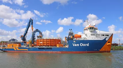 The cable layer Nexus (2014) owned by the Dutch maritime company Van Oord, which specializes in dredging including land reclamation, beach washing and the construction of artificial islands. Seen in the port of Rotterdam.