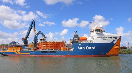 The cable layer Nexus (2014) owned by the Dutch maritime company Van Oord, which specializes in dredging including land reclamation, beach washing and the construction of artificial islands. Seen in the port of Rotterdam.