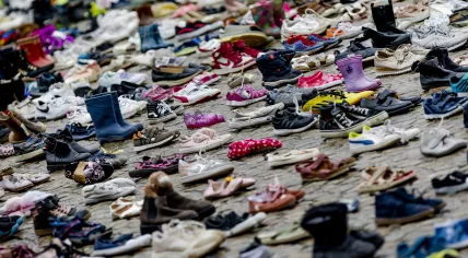 Thousands of children's shoes placed on Dam Square during a memorial event for child victims who died during the war in the Gaza Strip, January 2024.