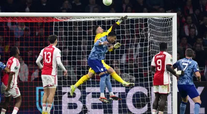 Ajax goalkeeper Diant Ramaj, Ezri Konsa of Aston Villa FC during the UEFA Conference League round of 16 match between Ajax Amsterdam and Aston Villa FC at the Johan Cruijff ArenA on March 7, 2024 in Amsterdam, Netherlands