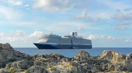 The Nieuw Amsterdam, a Holland America Line cruise ship, anchored off Half Moon Cay / Little San Salvador Island in the Bahamas. 7 October 2020