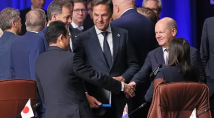 Dutch Prime Minister Mark Rutte with Japanese PM Fumio Kishida and German Chancellor Olaf Scholz at a NATO summit in Lithuania, 12 July 2023
