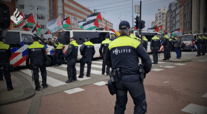 A large police presence at a pro-Palestine protest on Waterlooplein in Amsterdam, 10 March 2024. Demonstrators protested against the Israeli president's presence at the opening of the National Holocaust Museum while over 30,000 Palestians have died in Israeli attacks on Gaza