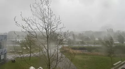 Strong wind gusts, heavy rain and hail accompany lightning in the skies over Amsterdam-Oost. 15 April 2024