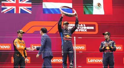 Winner Red Bull driver Max Verstappen of the Netherlands, center, celebrates on the podium with second placed McLaren driver Lando Norris of Britain, left, and third Red Bull driver Sergio Perez of Mexico after the Chinese Formula One Grand Prix at the Shanghai International Circuit, Shanghai, China, Sunday, April 21, 2024.